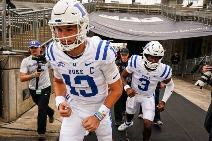 Sep 23, 2023; East Hartford, Connecticut, USA; Duke Blue Devils quarterback Riley Leonard (13) heads onto the field to warm up before the start of the game against the UConn Huskies at Rentschler Field at Pratt & Whitney Stadium. Mandatory Credit: David Butler II-USA TODAY Sports