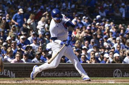 Sep 23, 2023; Chicago, Illinois, USA; Chicago Cubs second baseman Nico Hoerner (2) hits a single against the Colorado Rockies during the first inning at Wrigley Field. Mandatory Credit: Matt Marton-USA TODAY Sports