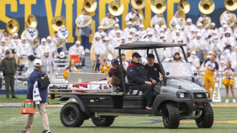 Sep 23, 2023; Morgantown, West Virginia, USA; Texas Tech Red Raiders quarterback Tyler Shough (12) gestures as he is carted off the field after an injury during the first quarter against the West Virginia Mountaineers at Mountaineer Field at Milan Puskar Stadium. Mandatory Credit: Ben Queen-USA TODAY Sports