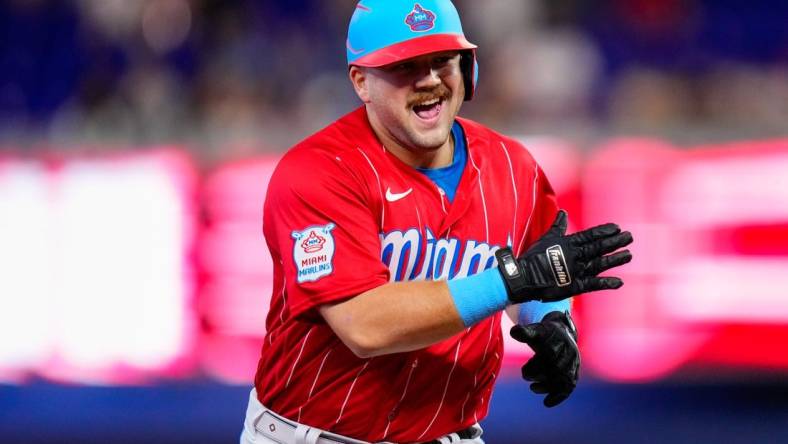 Sep 23, 2023; Miami, Florida, USA; Miami Marlins third baseman Jake Burger (36) celebrates hitting a three run home run against the Milwaukee Brewers during the first inning at loanDepot Park. Mandatory Credit: Rich Storry-USA TODAY Sports