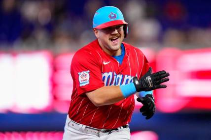 Sep 23, 2023; Miami, Florida, USA; Miami Marlins third baseman Jake Burger (36) celebrates hitting a three run home run against the Milwaukee Brewers during the first inning at loanDepot Park. Mandatory Credit: Rich Storry-USA TODAY Sports