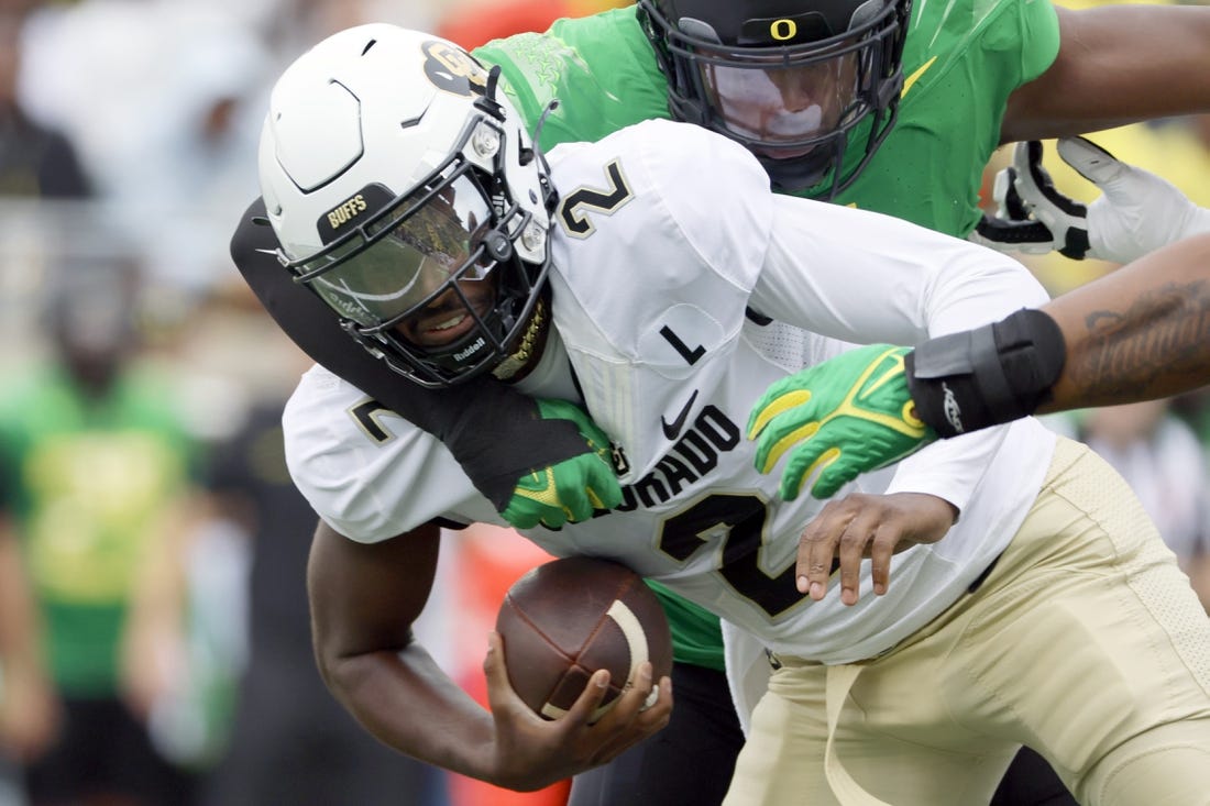 Sep 23, 2023; Eugene, Oregon, USA; Oregon Ducks defensive end Jordan Burch (1) sacks Colorado Buffaloes quarterback Shedeur Sanders (2) during the first half at Autzen Stadium. Mandatory Credit: Soobum Im-USA TODAY Sports