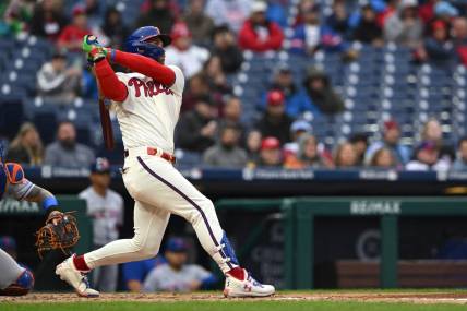 Sep 23, 2023; Philadelphia, Pennsylvania, USA;  Philadelphia Phillies designated hitter Bryce Harper (3) hits a solo home run in the second inning against the New York Mets at Citizens Bank Park. Mandatory Credit: John Geliebter-USA TODAY Sports