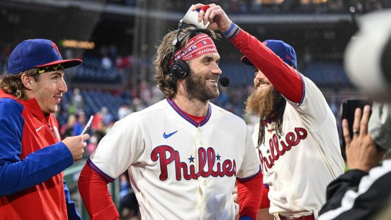 Sep 23, 2023; Philadelphia, Pennsylvania, USA;  Philadelphia Phillies center fielder Brandon Marsh and  second baseman Bryson Stott harass designated hitter Bryce Harper during a post game interview after the game against the New York Mets at Citizens Bank Park. Philadelphia won 7-5. Mandatory Credit: John Geliebter-USA TODAY Sports