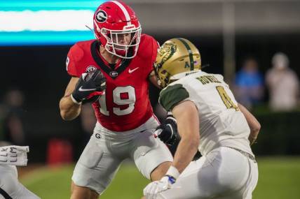 Sep 23, 2023; Athens, Georgia, USA; Georgia Bulldogs tight end Brock Bowers (19) runs against UAB Blazers safety Ike Rowell (4) after a catch during the first quarter at Sanford Stadium. Mandatory Credit: Dale Zanine-USA TODAY Sports