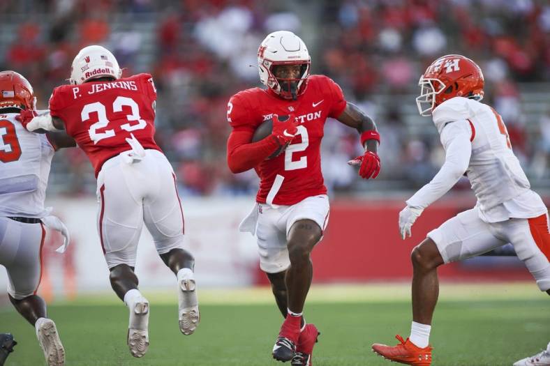 Sep 23, 2023; Houston, Texas, USA; Houston Cougars wide receiver Matthew Golden (2) runs with the ball during the first quarter against the Sam Houston State Bearkats at TDECU Stadium. Mandatory Credit: Troy Taormina-USA TODAY Sports
