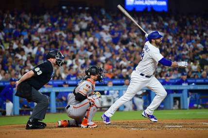 Sep 23, 2023; Los Angeles, California, USA; Los Angeles Dodgers designated hitter J.D. Martinez (28) hits a two run RBI double against the San Francisco Giants during the third inning at Dodger Stadium. Mandatory Credit: Gary A. Vasquez-USA TODAY Sports