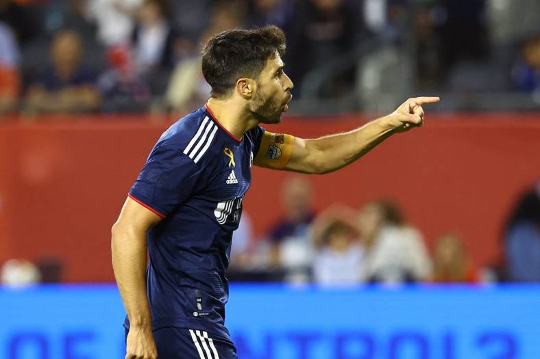 Sep 23, 2023; Chicago, Illinois, USA; New England Revolution midfielder Carles Gil (10) reacts after scoring a goal against the Chicago Fire during the second half at Soldier Field. Mandatory Credit: Mike Dinovo-USA TODAY Sports
