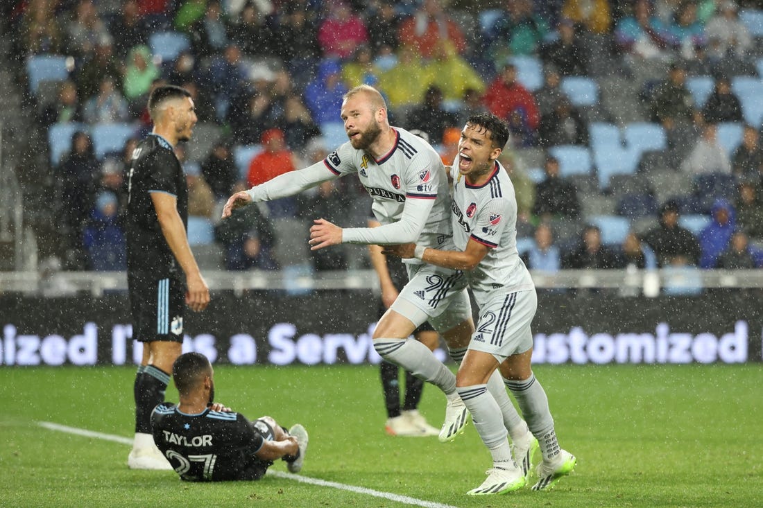 Sep 23, 2023; Saint Paul, Minnesota, USA; St. Louis City SC forward Klauss (9) celebrates goal with midfielder Celio Pompeu (12) in the second half against the Minnesota United FC at Allianz Field. Mandatory Credit: Matt Krohn-USA TODAY Sports