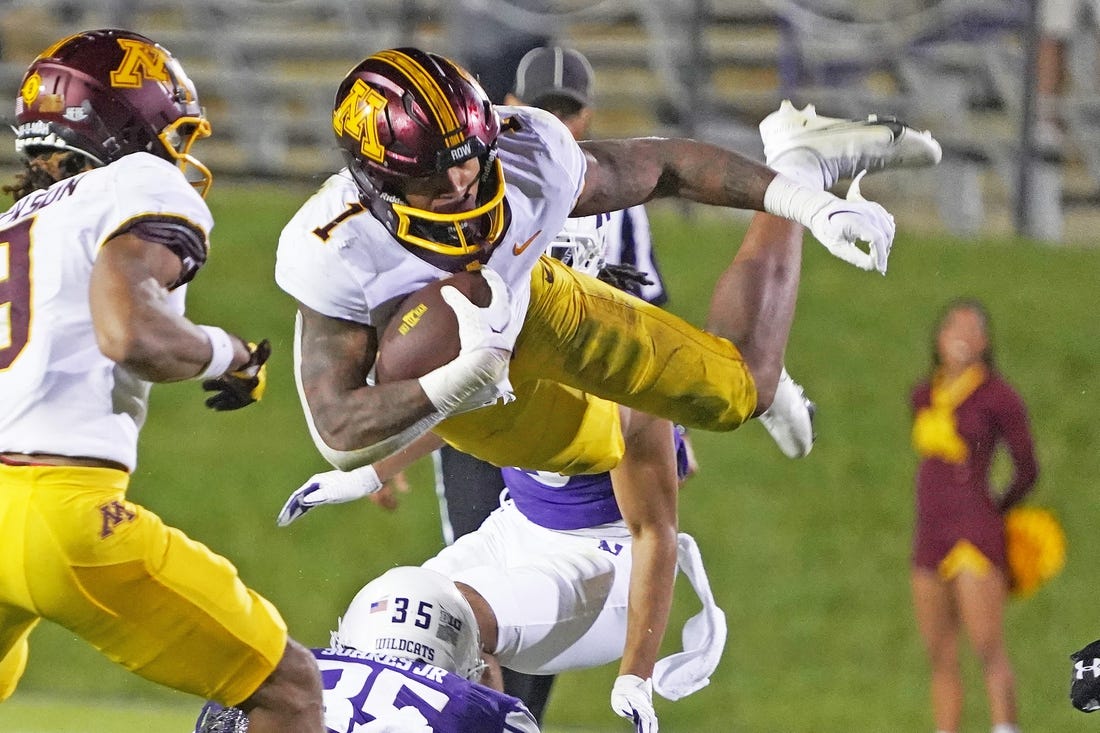 Sep 23, 2023; Evanston, Illinois, USA; Minnesota Golden Gophers running back Darius Taylor (1) leaps over Northwestern Wildcats linebacker Kenny Soares Jr. (35) during the second half at Ryan Field. Mandatory Credit: David Banks-USA TODAY Sports