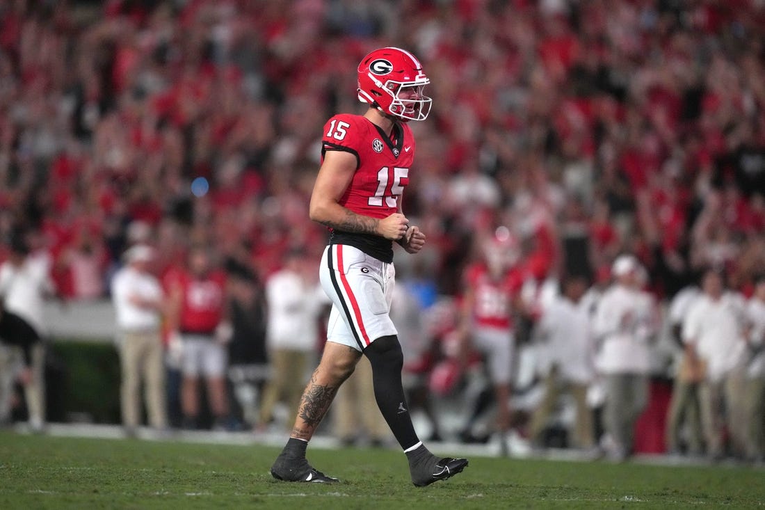 Sep 23, 2023; Athens, Georgia, USA; Georgia Bulldogs quarterback Carson Beck (15) reacts after a touchdown against the UAB Blazers in the second half at Sanford Stadium. Mandatory Credit: Kirby Lee-USA TODAY Sports