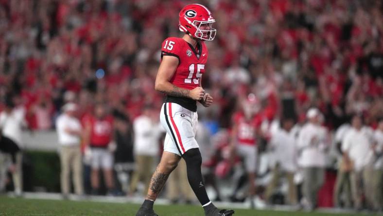 Sep 23, 2023; Athens, Georgia, USA; Georgia Bulldogs quarterback Carson Beck (15) reacts after a touchdown against the UAB Blazers in the second half at Sanford Stadium. Mandatory Credit: Kirby Lee-USA TODAY Sports