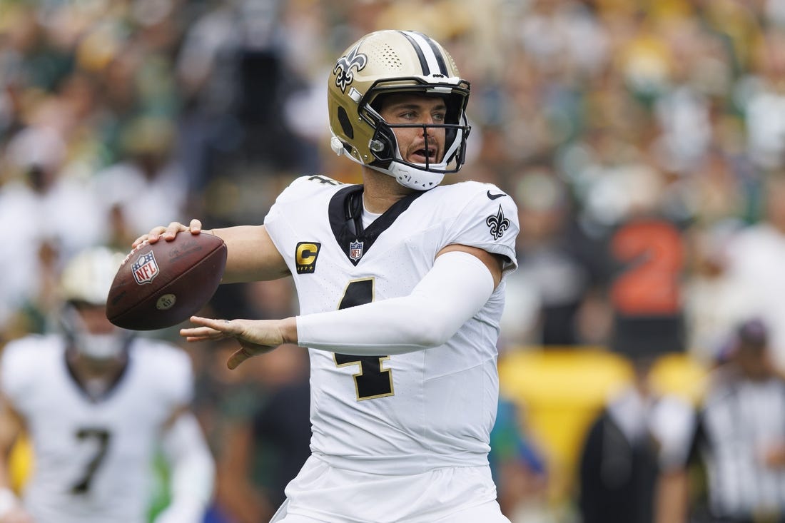 Sep 24, 2023; Green Bay, Wisconsin, USA;  New Orleans Saints quarterback Derek Carr (4) throws a pass during the first quarter against the Green Bay Packers at Lambeau Field. Mandatory Credit: Jeff Hanisch-USA TODAY Sports