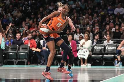 Sep 24, 2023; Brooklyn, New York, USA; Connecticut Sun guard Tiffany Hayes (15) drives to the basket in the second quarter against the New York Liberty during game one of the 2023 WNBA Playoffs at Barclays Center. Mandatory Credit: Wendell Cruz-USA TODAY Sports