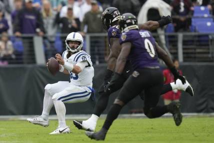 Sep 24, 2023; Baltimore, Maryland, USA; Indianapolis Colts quarterback Gardner Minshew (10) throws a pass while receiving pressure by Baltimore Ravens linebacker David Ojabo (90) and Baltimore Ravens linebacker Roquan Smith (0) in the first half at M&T Bank Stadium. Mandatory Credit: Brent Skeen-USA TODAY Sports