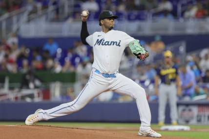 Sep 24, 2023; Miami, Florida, USA; Miami Marlins starting pitcher Edward Cabrera (27) delivers a pitch against the Milwaukee Brewers during the first inning at loanDepot Park. Mandatory Credit: Sam Navarro-USA TODAY Sports