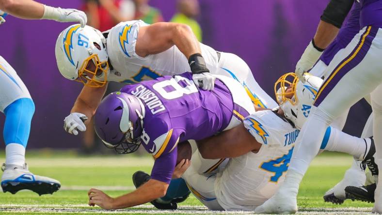 Sep 24, 2023; Minneapolis, Minnesota, USA; Los Angeles Chargers linebacker Joey Bosa (97) sacks Minnesota Vikings quarterback Kirk Cousins (8) in the first quarter at U.S. Bank Stadium. Mandatory Credit: Brad Rempel-USA TODAY Sports