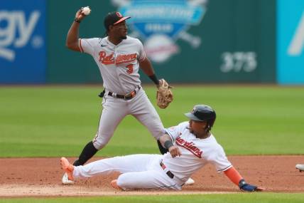 Sep 24, 2023; Cleveland, Ohio, USA; Baltimore Orioles shortstop Jorge Mateo (3) throws to first to complete a double play after forcing out Cleveland Guardians third baseman Jose Ramirez (11) during the first inning at Progressive Field. Mandatory Credit: Aaron Josefczyk-USA TODAY Sports