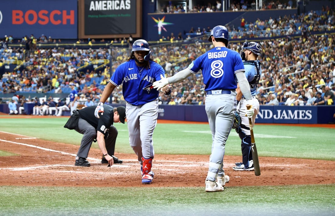 Sep 24, 2023; St. Petersburg, Florida, USA; Toronto Blue Jays first baseman Vladimir Guerrero Jr. (27) is congratulated by second baseman Cavan Biggio (8) after he hit a home run against the Tampa Bay Rays during the sixth inning at Tropicana Field. Mandatory Credit: Kim Klement Neitzel-USA TODAY Sports