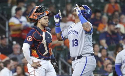 Sep 24, 2023; Houston, Texas, USA; Houston Astros catcher Yainer Diaz (21) looks on as Kansas City Royals designated hitter Salvador Perez (13) celebrates after hitting a home run during the third inning at Minute Maid Park. Mandatory Credit: Troy Taormina-USA TODAY Sports