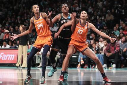 Sep 24, 2023; Brooklyn, New York, USA; New York Liberty forward Jonquel Jones (35) boxes out for a rebound on Connecticut Sun forwards DeWanna Bonner (24) and Olivia Nelson-Ododa (10) in the third quarter during game one of the 2023 WNBA Playoffs at Barclays Center. Mandatory Credit: Wendell Cruz-USA TODAY Sports