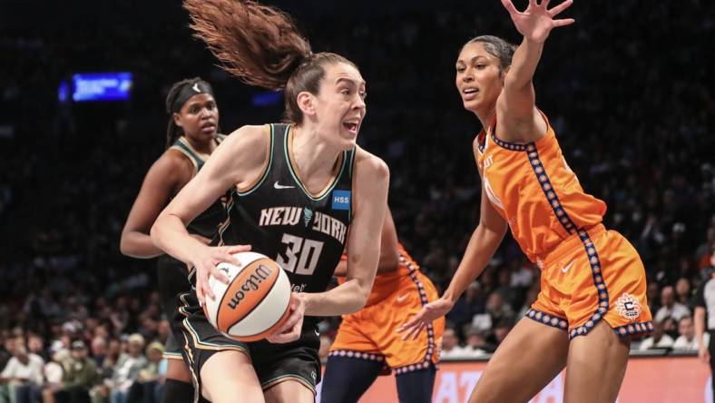 Sep 24, 2023; Brooklyn, New York, USA; New York Liberty forward Breanna Stewart (30) looks to drive past Connecticut Sun forward Olivia Nelson-Ododa (10) in the fourth quarter during game one of the 2023 WNBA Playoffs at Barclays Center. Mandatory Credit: Wendell Cruz-USA TODAY Sports