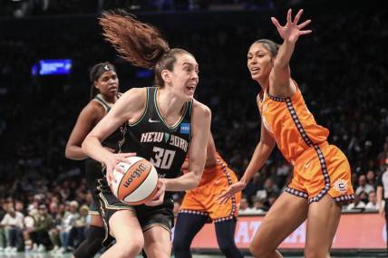 Sep 24, 2023; Brooklyn, New York, USA; New York Liberty forward Breanna Stewart (30) looks to drive past Connecticut Sun forward Olivia Nelson-Ododa (10) in the fourth quarter during game one of the 2023 WNBA Playoffs at Barclays Center. Mandatory Credit: Wendell Cruz-USA TODAY Sports