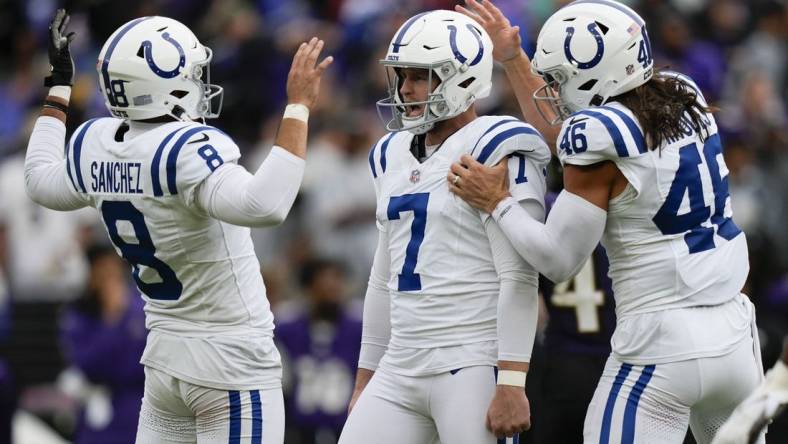 Sep 24, 2023; Baltimore, Maryland, USA; Indianapolis Colts punter Rigoberto Sanchez (8), Indianapolis Colts place kicker Matt Gay (7), and Indianapolis Colts long snapper Luke Rhodes (46) react after Gay kicks a game winning field goal in overtime to beat the Baltimore Ravens at M&T Bank Stadium. Mandatory Credit: Brent Skeen-USA TODAY Sports