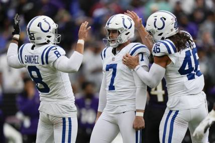 Sep 24, 2023; Baltimore, Maryland, USA; Indianapolis Colts punter Rigoberto Sanchez (8), Indianapolis Colts place kicker Matt Gay (7), and Indianapolis Colts long snapper Luke Rhodes (46) react after Gay kicks a game winning field goal in overtime to beat the Baltimore Ravens at M&T Bank Stadium. Mandatory Credit: Brent Skeen-USA TODAY Sports