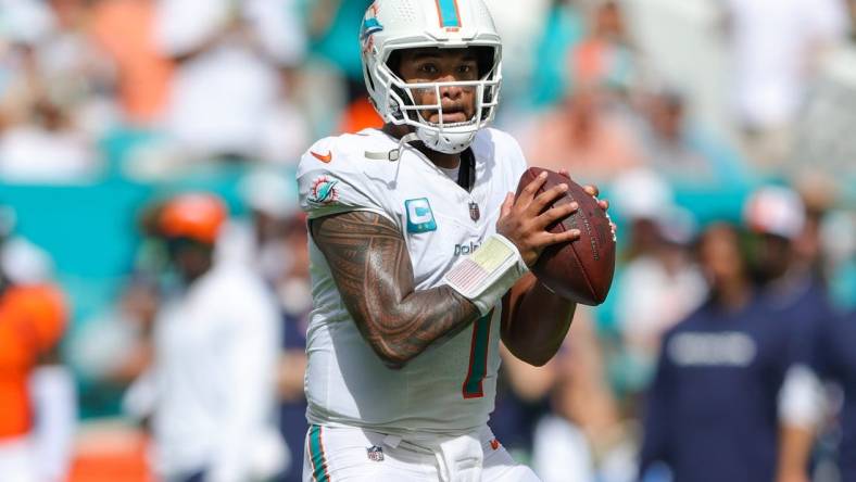 Sep 24, 2023; Miami Gardens, Florida, USA;  Miami Dolphins quarterback Tua Tagovailoa (1) drops back to pass against the Denver Broncos in the third quarter at Hard Rock Stadium. Mandatory Credit: Nathan Ray Seebeck-USA TODAY Sports