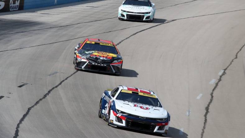 Sep 24, 2023; Fort Worth, Texas, USA;  NASCAR Cup Series driver William Byron (24) and driver Martin Truex Jr. (19) during the AutoTrader EcoPark Automotive 400 at Texas Motor Speedway. Mandatory Credit: Michael C. Johnson-USA TODAY Sports