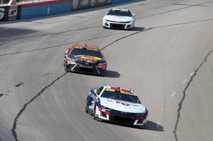 Sep 24, 2023; Fort Worth, Texas, USA;  NASCAR Cup Series driver William Byron (24) and driver Martin Truex Jr. (19) during the AutoTrader EcoPark Automotive 400 at Texas Motor Speedway. Mandatory Credit: Michael C. Johnson-USA TODAY Sports