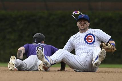 Sep 24, 2023; Chicago, Illinois, USA;   Chicago Cubs second baseman Nico Hoerner (2) after tagging Colorado Rockies center fielder Brenton Doyle (9) out on an attempted steal during the eighth inning at Wrigley Field. Mandatory Credit: Matt Marton-USA TODAY Sports