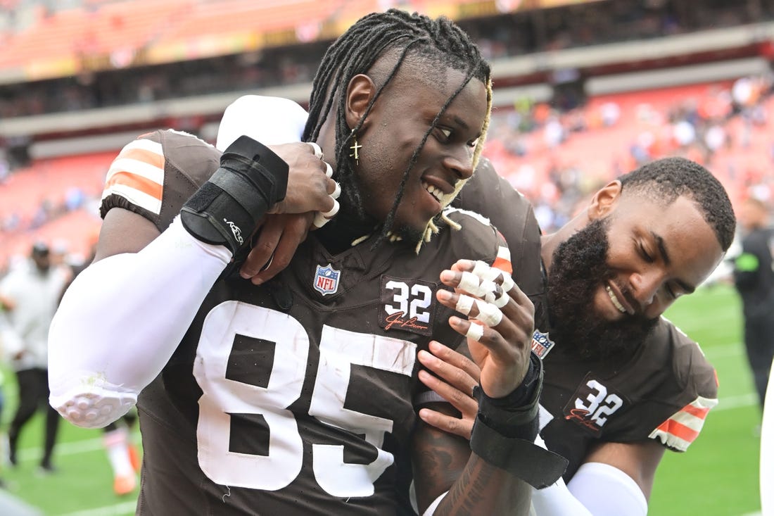 Sep 24, 2023; Cleveland, Ohio, USA; Cleveland Browns tight end David Njoku (85) and linebacker Anthony Walker Jr. (5) celebrate after the Browns beat the Tennessee Titans at Cleveland Browns Stadium. Mandatory Credit: Ken Blaze-USA TODAY Sports