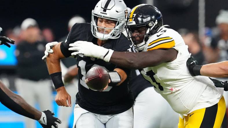 Sep 24, 2023; Paradise, Nevada, USA; Pittsburgh Steelers defensive tackle Montravius Adams (57) pressures Las Vegas Raiders quarterback Jimmy Garoppolo (10) during the first quarter at Allegiant Stadium. Mandatory Credit: Stephen R. Sylvanie-USA TODAY Sports