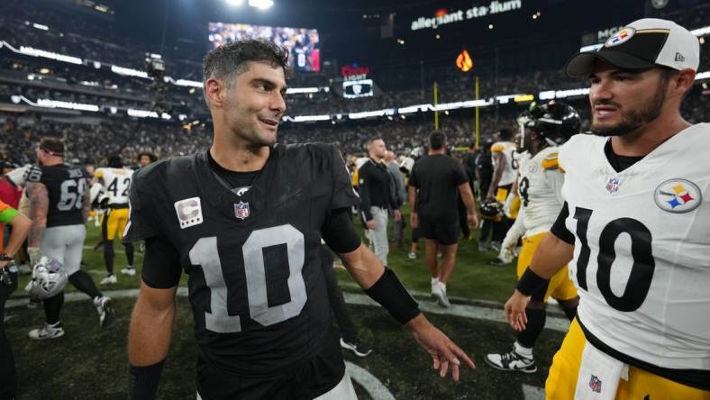 Sep 24, 2023; Paradise, Nevada, USA; Las Vegas Raiders quarterback Jimmy Garoppolo (left) talks with Pittsburgh Steelers quarterback Mitch Trubisky after the game at Allegiant Stadium. Mandatory Credit: Kirby Lee-USA TODAY Sports