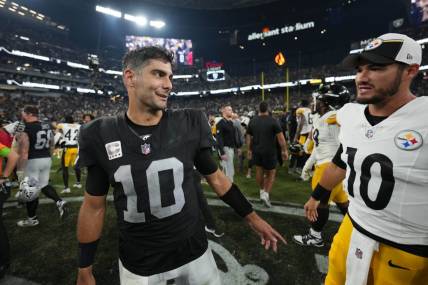 Sep 24, 2023; Paradise, Nevada, USA; Las Vegas Raiders quarterback Jimmy Garoppolo (left) talks with Pittsburgh Steelers quarterback Mitch Trubisky after the game at Allegiant Stadium. Mandatory Credit: Kirby Lee-USA TODAY Sports