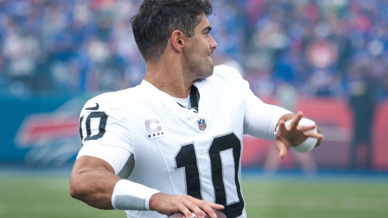 Sep 17, 2023; Orchard Park, New York, USA; Las Vegas Raiders quarterback Jimmy Garoppolo (10) warms up before a game against the Buffalo Bills at Highmark Stadium. Mandatory Credit: Mark Konezny-USA TODAY Sports