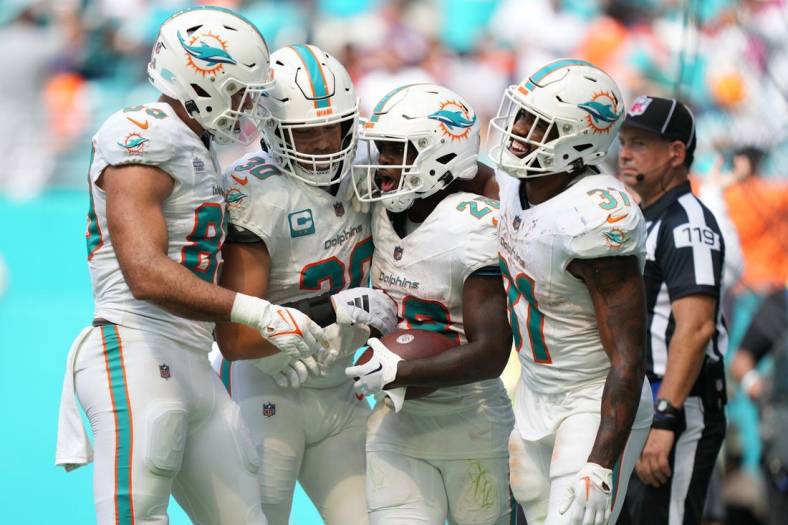 Miami Dolphins running back De'Von Achane (28) celebrates a touchdown in the fourth quarter against the Denver Broncos during an NFL game at Hard Rock Stadium in Miami Gardens, Sept. 24, 2023.