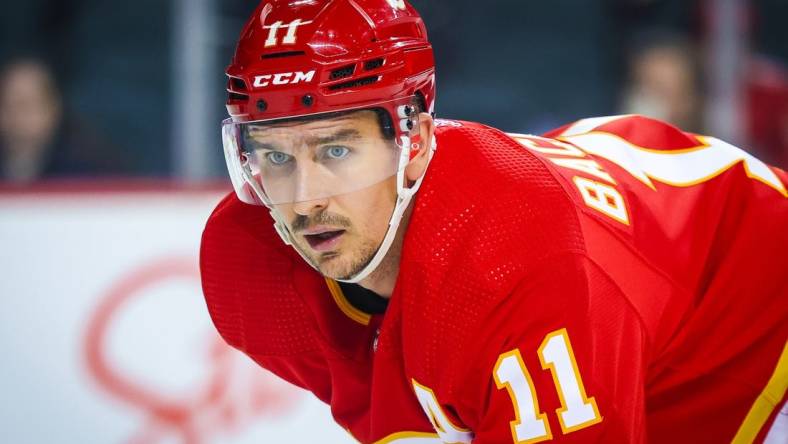 Sep 25, 2023; Calgary, Alberta, CAN; Calgary Flames center Mikael Backlund (11) during the face off against the Seattle Kraken during the second period at Scotiabank Saddledome. Mandatory Credit: Sergei Belski-USA TODAY Sports