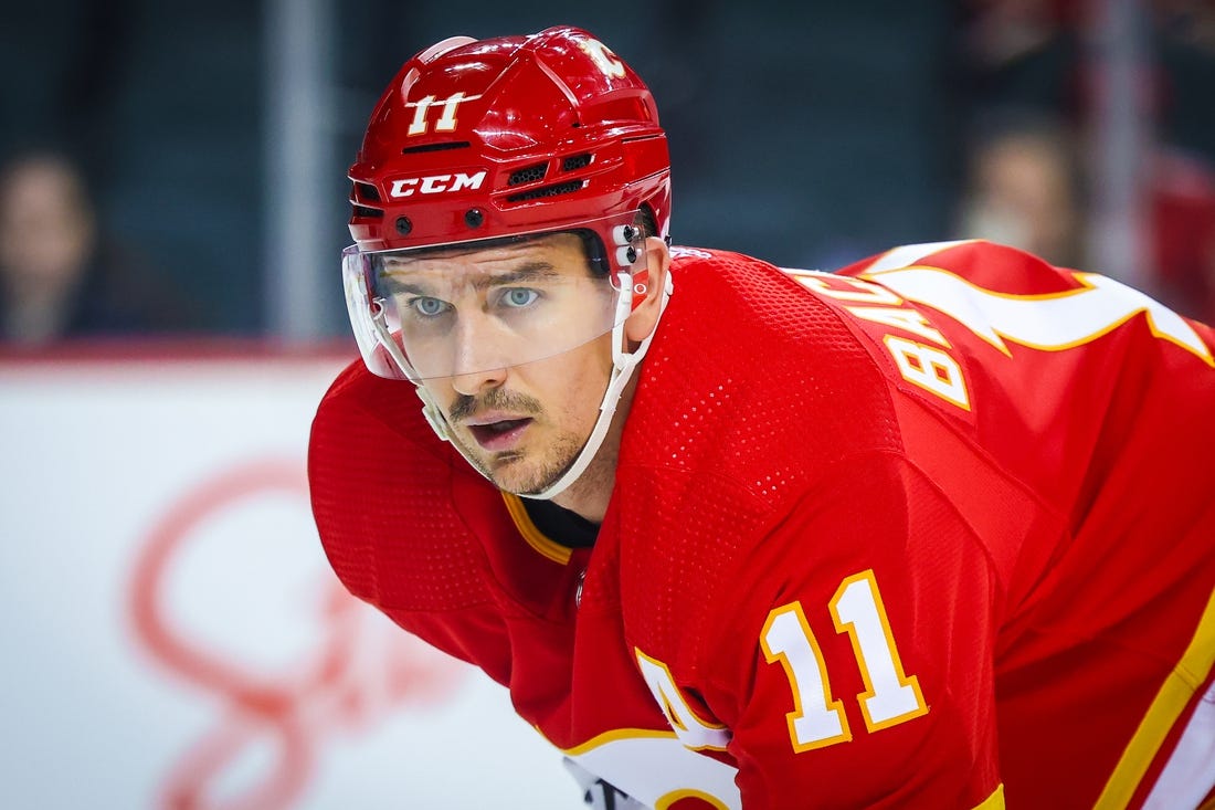 Sep 25, 2023; Calgary, Alberta, CAN; Calgary Flames center Mikael Backlund (11) during the face off against the Seattle Kraken during the second period at Scotiabank Saddledome. Mandatory Credit: Sergei Belski-USA TODAY Sports