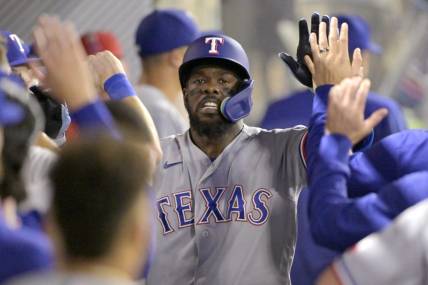 Sep 25, 2023; Anaheim, California, USA; Texas Rangers right fielder Adolis Garcia (53) celebrates in the dugout after hitting a solo home run in the sixth inning against the Los Angeles Angels at Angel Stadium. Mandatory Credit: Jayne Kamin-Oncea-USA TODAY Sports