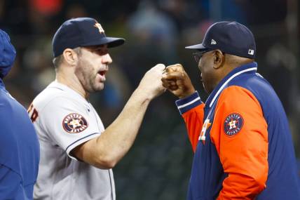 Sep 25, 2023; Seattle, Washington, USA; Houston Astros manager Dusty Baker Jr. (12, right) bumps fists with starting pitcher Justin Verlander (35) following a 5-1 victory against the Seattle Mariners at T-Mobile Park. Mandatory Credit: Joe Nicholson-USA TODAY Sports
