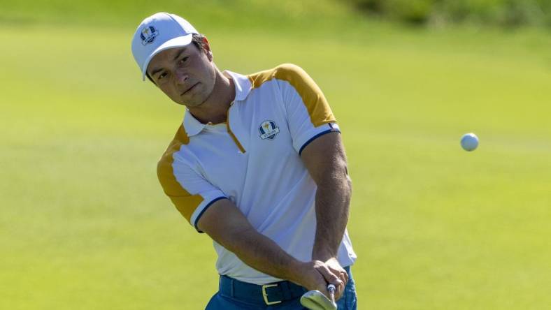 September 26, 2023; Rome, ITALY; Team Europe golfer Viktor Hovland hits his chip shot on the second hole during a practice round of the Ryder Cup golf competition at Marco Simone Golf and Country Club. Mandatory Credit: Kyle Terada-USA TODAY Sports