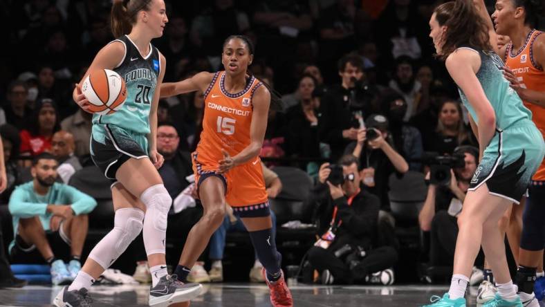 Sep 26, 2023; Brooklyn, New York, USA; New York Liberty guard Sabrina Ionescu (20) sets the play as Connecticut Sun guard Tiffany Hayes (15) defends during the first half of game two of the 2023 WNBA Playoffs at Barclays Center. Mandatory Credit: John Jones-USA TODAY Sports