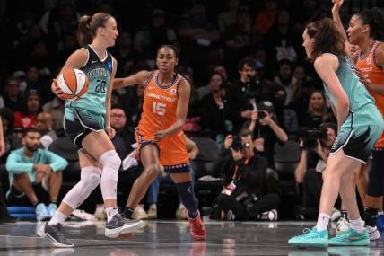 Sep 26, 2023; Brooklyn, New York, USA; New York Liberty guard Sabrina Ionescu (20) sets the play as Connecticut Sun guard Tiffany Hayes (15) defends during the first half of game two of the 2023 WNBA Playoffs at Barclays Center. Mandatory Credit: John Jones-USA TODAY Sports