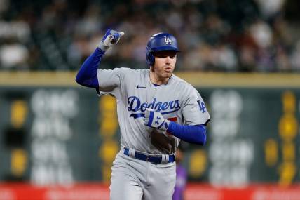 Sep 26, 2023; Denver, Colorado, USA; Los Angeles Dodgers first baseman Freddie Freeman (5) gestures as he rounds the bases on a solo home run in the sixth inning against the Colorado Rockies at Coors Field. Mandatory Credit: Isaiah J. Downing-USA TODAY Sports