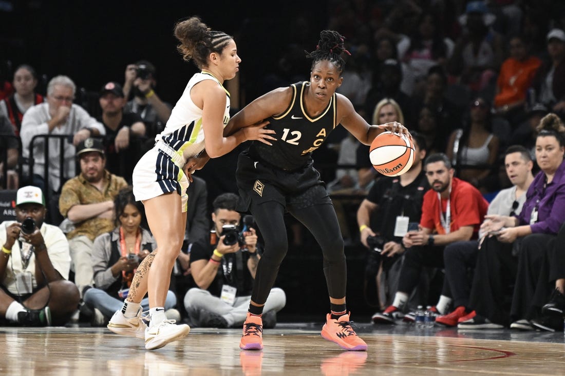 Sep 26, 2023; Las Vegas, Nevada, USA; Las Vegas Aces guard Chelsea Gray (12) is guarded by Dallas Wings guard Veronica Burton (12) in the first half of game two of the 2023 WNBA Playoffs at Michelob Ultra Arena. Mandatory Credit: Candice Ward-USA TODAY Sports