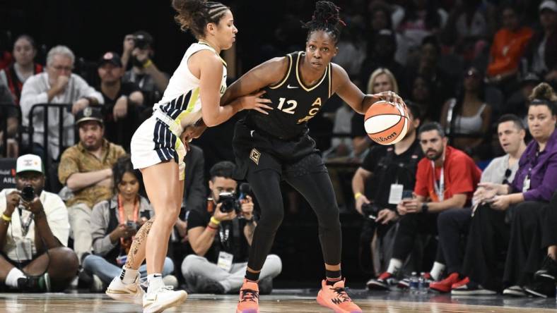 Sep 26, 2023; Las Vegas, Nevada, USA; Las Vegas Aces guard Chelsea Gray (12) is guarded by Dallas Wings guard Veronica Burton (12) in the first half of game two of the 2023 WNBA Playoffs at Michelob Ultra Arena. Mandatory Credit: Candice Ward-USA TODAY Sports