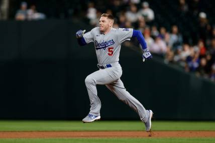 Sep 26, 2023; Denver, Colorado, USA; Los Angeles Dodgers first baseman Freddie Freeman (5) runs to second on a double in the ninth inning against the Colorado Rockies at Coors Field. Mandatory Credit: Isaiah J. Downing-USA TODAY Sports